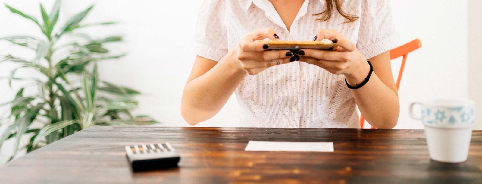 A lady making a mobile deposit