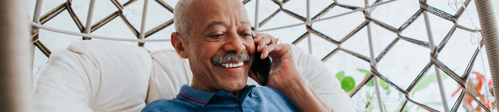 Man using a phone while relaxing